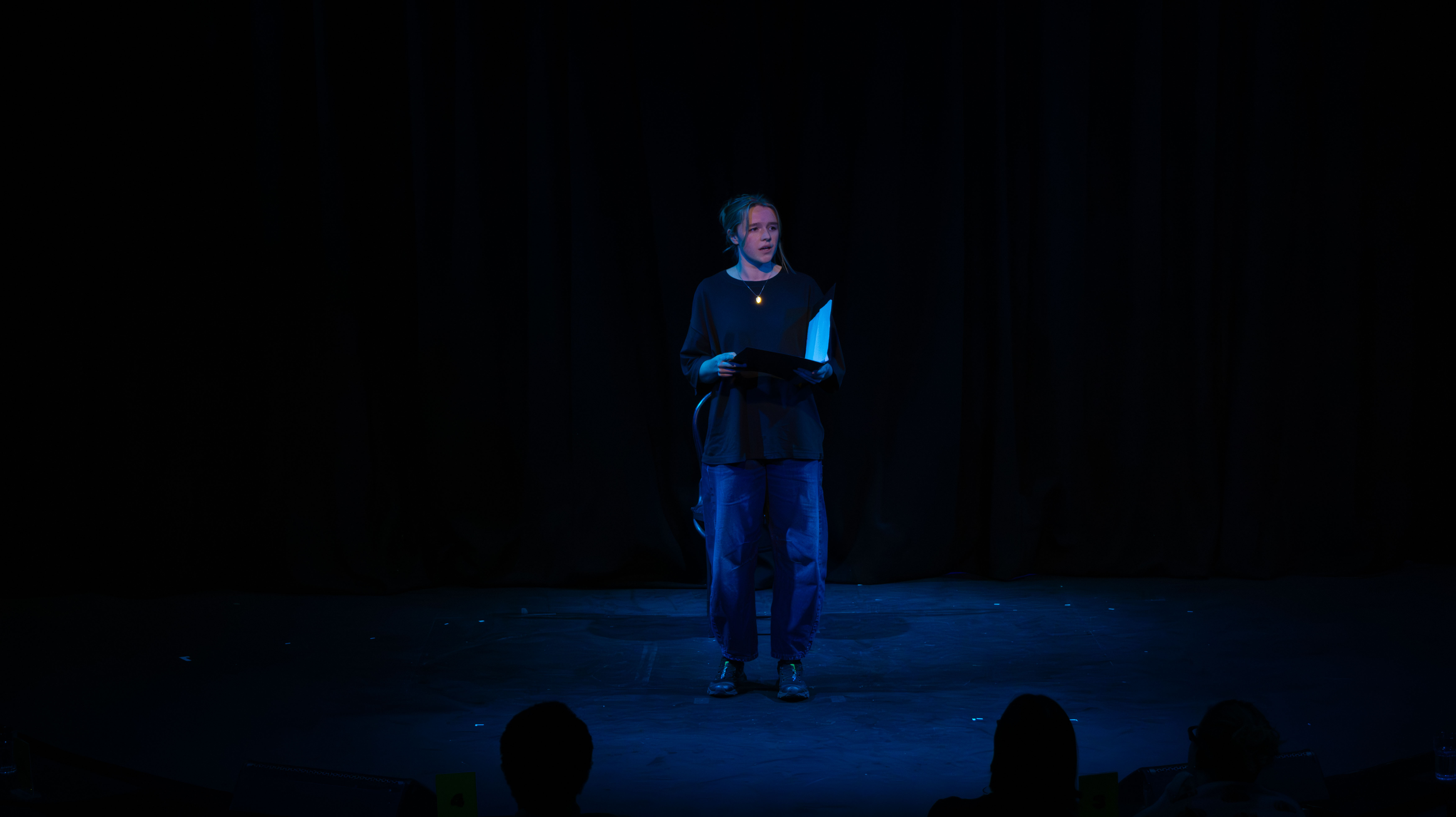 Liv onstage as Mag. Teal light.