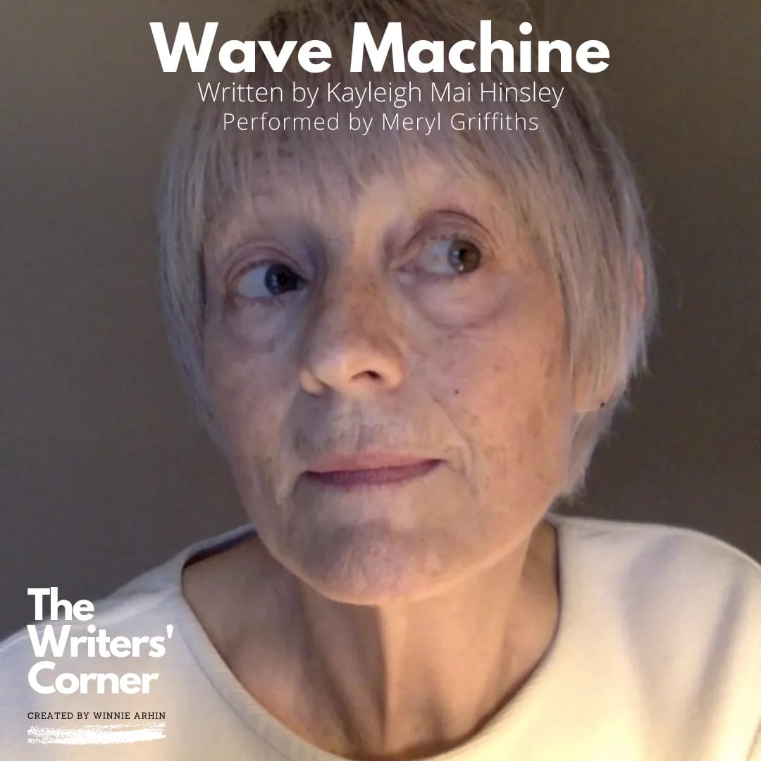 A promotional image for Wave Machine. Meryl, an older white woman with short grey hair wearing a white top, is looking off to the right. Over the image is some white text which reads: Wave Machine, written by Kayleigh Mai Hinsley, performed by Meryl Griffiths. In the bottom corner is a logo which reads: The Writers’ Corner, created by Winnie Arhin.
